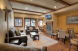 Step into luxury with this stunning living space, featuring a cozy fireplace and a modern desk area, perfect for work or relaxation.