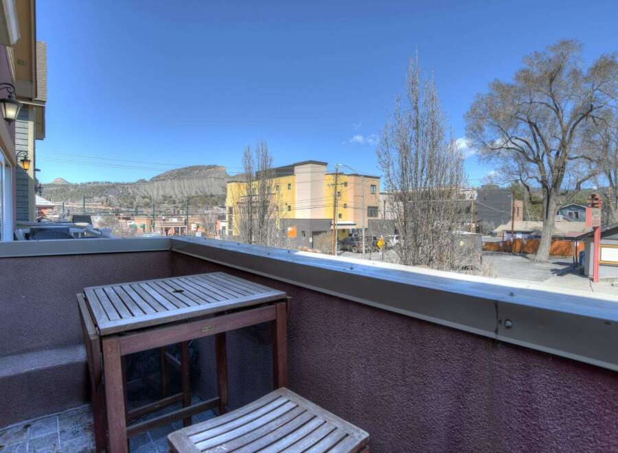 Enjoy stunning views from this charming balcony! This property features a cozy outdoor space, perfect for relaxing and taking in the surrounding scenery.