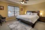 This stunning bedroom boasts a luxurious king-sized bed, perfect for a restful night's sleep.