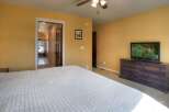 This inviting bedroom features a comfortable bed and a stylish dresser, perfect for relaxation.