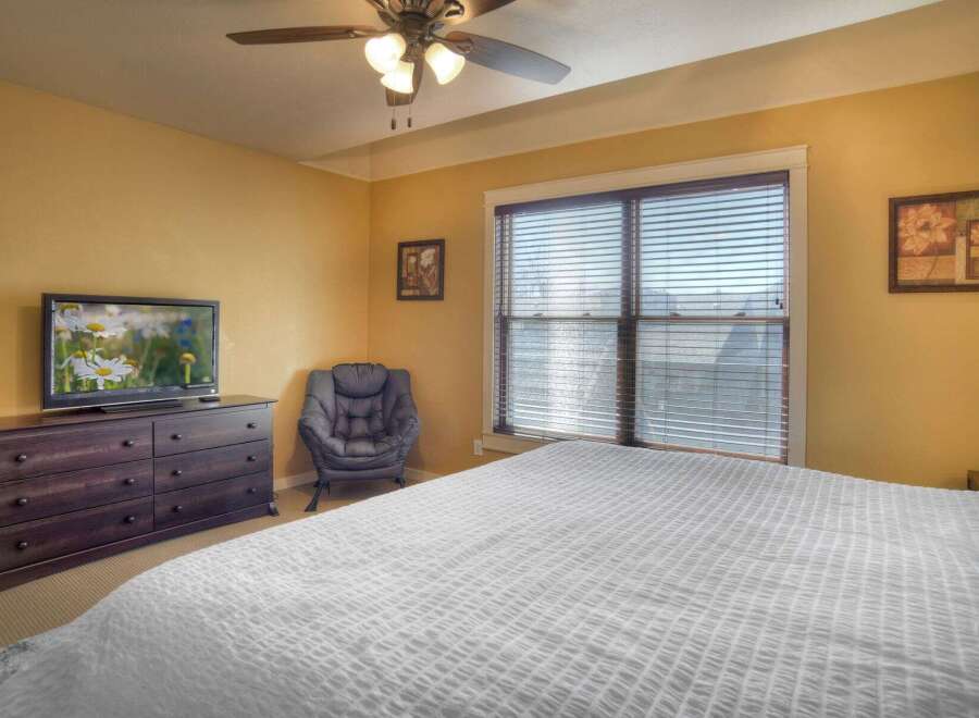 This inviting bedroom features a comfortable bed, perfect for relaxation.