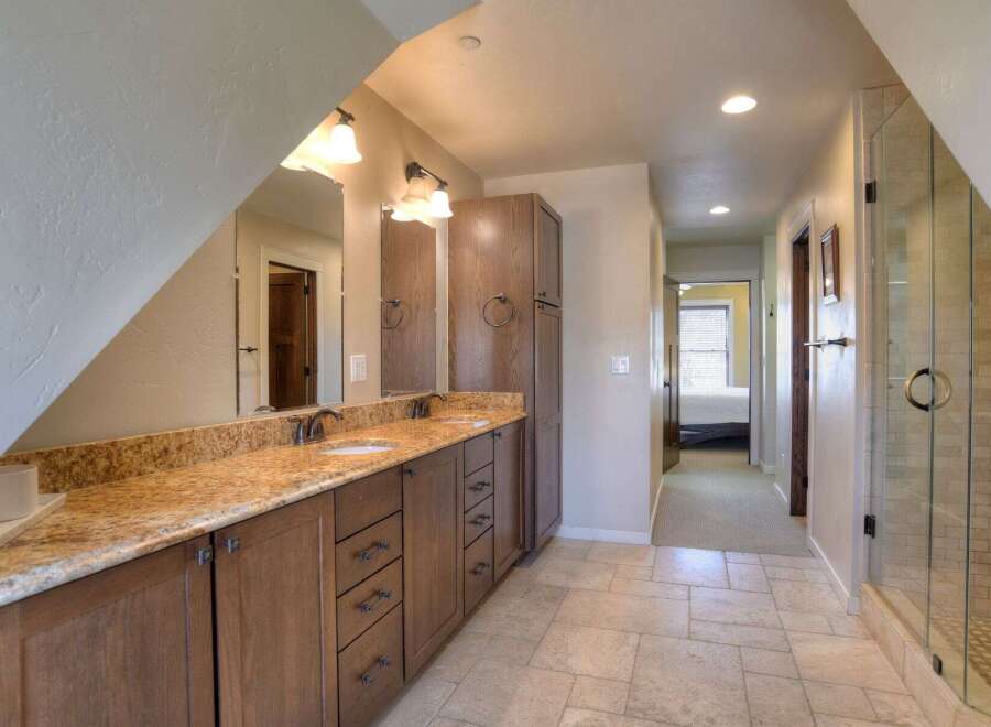 Step into luxury with this stunning bathroom! Featuring a spacious vanity with ample storage, a beautiful countertop, and a well-lit mirror, this bathroom is designed for both style and functionality.