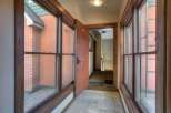 Step into this inviting entryway, showcasing beautiful wooden trim and abundant natural light.