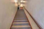Ascend to your new home with these inviting stairs! This property features a well-maintained staircase, leading to a potential unit or common area.
