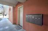 This property offers a welcoming entrance with a well-maintained walkway and a secure mailbox system.