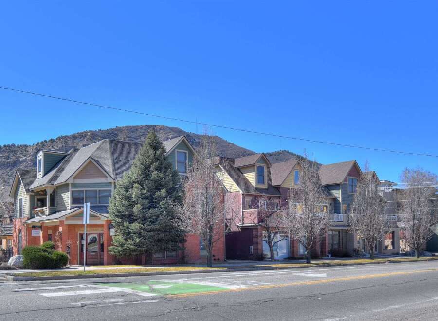 Discover charming multi-family homes nestled in a picturesque setting.