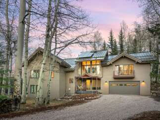 This stunning property boasts a modern design with a touch of rustic charm.