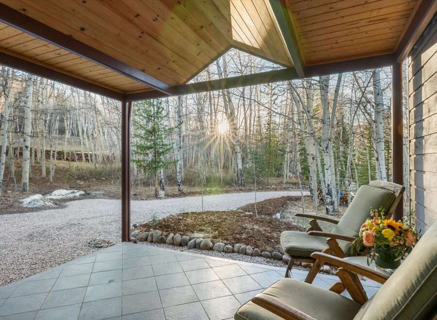 Enjoy the tranquility of nature from this charming porch.