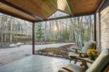 Enjoy the tranquility of nature from this charming porch.