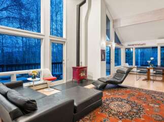 Step into a modern living space with stunning views.