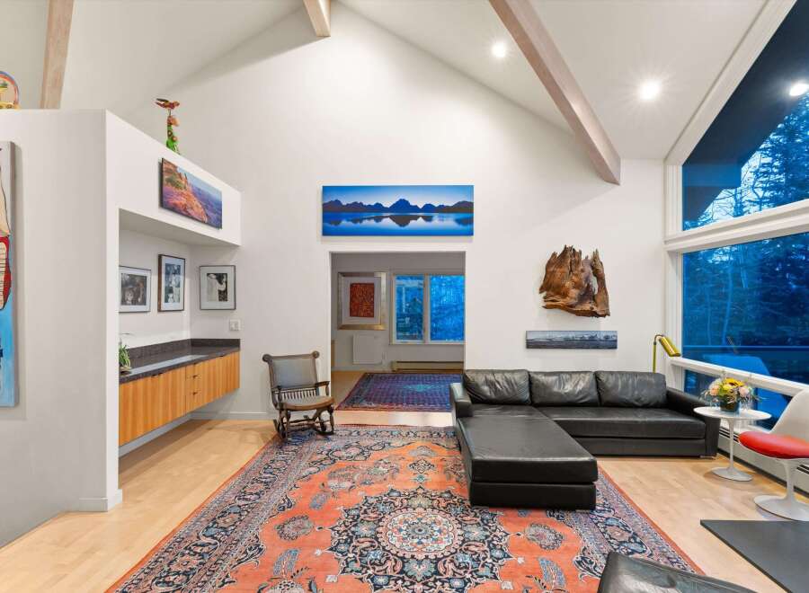 Step into luxury with this stunning living space, featuring a modern design and high ceilings.