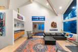 Step into luxury with this stunning living space, featuring a modern design and high ceilings.
