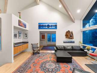 Step into luxury with this stunning living space, featuring a modern design and high ceilings.