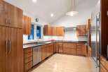 This stunning kitchen boasts custom cabinetry, offering ample storage and a sleek, modern aesthetic.