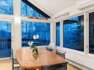 This stunning property boasts a bright and airy dining area, perfect for entertaining or enjoying a quiet meal.