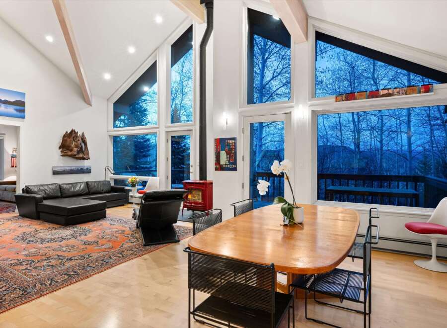 Experience luxury living in this stunning property featuring soaring ceilings and expansive windows that flood the space with natural light.