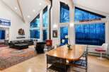 Experience luxury living in this stunning property featuring soaring ceilings and expansive windows that flood the space with natural light.
