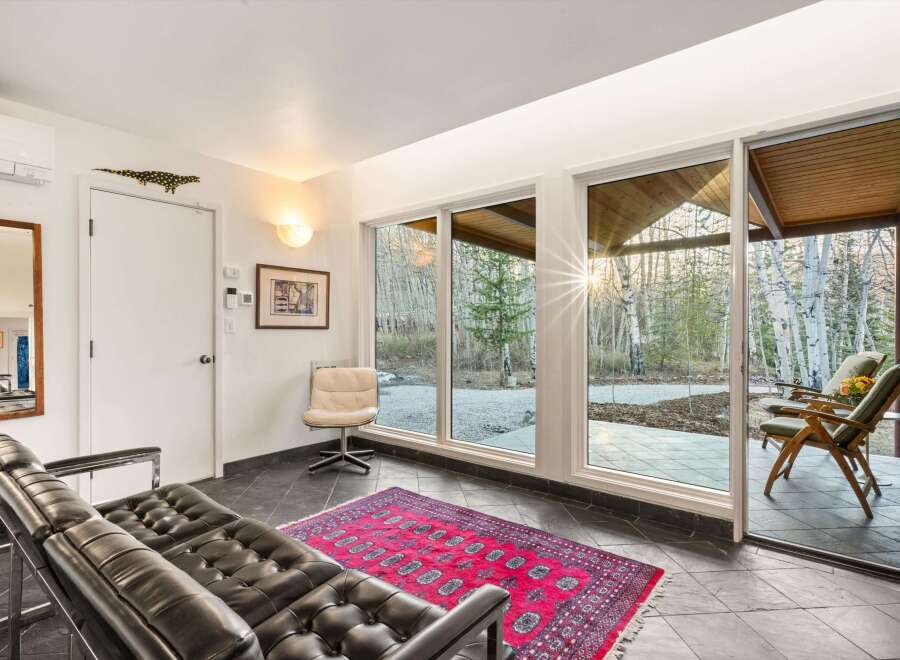 Step into a stunning living space with expansive windows that frame breathtaking views of the surrounding landscape.