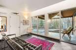 Step into a stunning living space with expansive windows that frame breathtaking views of the surrounding landscape.