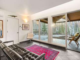 Step into a stunning living space with expansive windows that frame breathtaking views of the surrounding landscape.