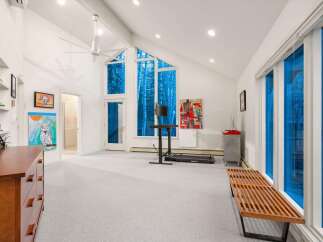 This stunning property boasts a bright and airy interior with high ceilings and large windows that flood the space with natural light.