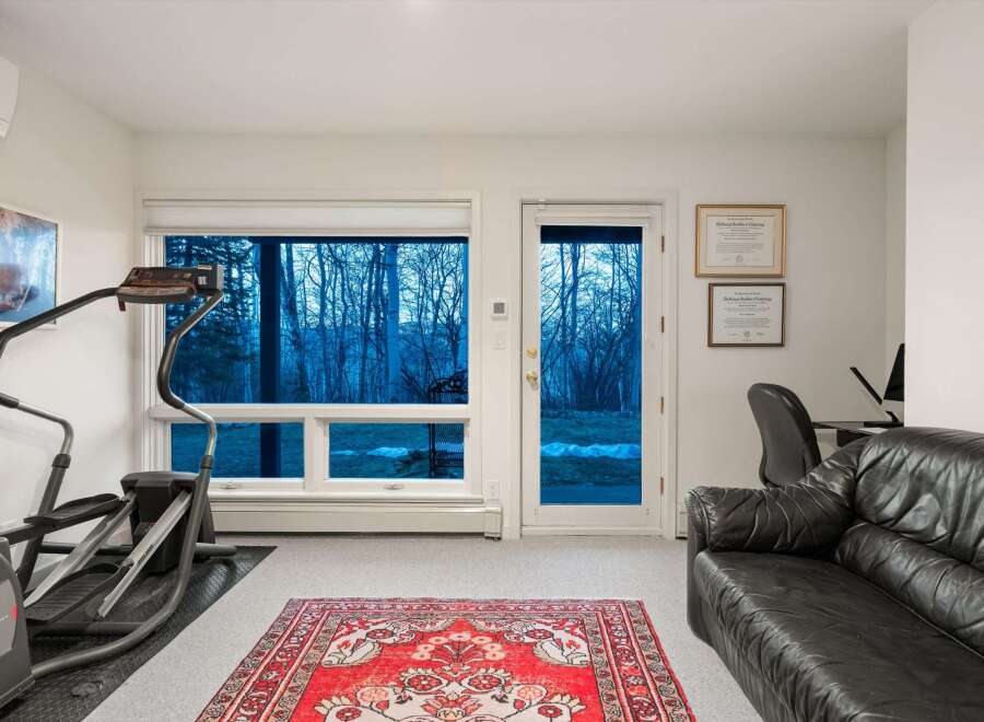 This stunning property boasts a bright and airy home gym, perfect for maintaining a healthy lifestyle.