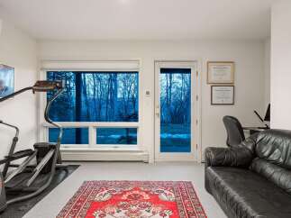 This stunning property boasts a bright and airy home gym, perfect for maintaining a healthy lifestyle.
