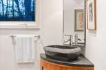 This stunning bathroom features a unique design with a modern touch.
