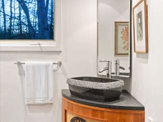 This stunning bathroom features a unique design with a modern touch.