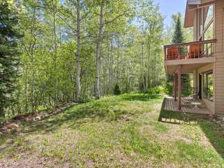 Experience the serene beauty of this mountain retreat, nestled amongst lush aspen and pine trees.