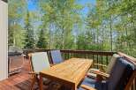 Enjoy outdoor dining and grilling on this spacious deck surrounded by beautiful aspen trees.