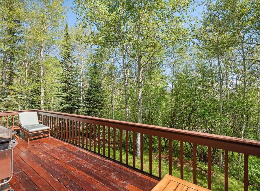 Enjoy the serene mountain views from this spacious deck, perfect for outdoor entertaining or quiet relaxation.