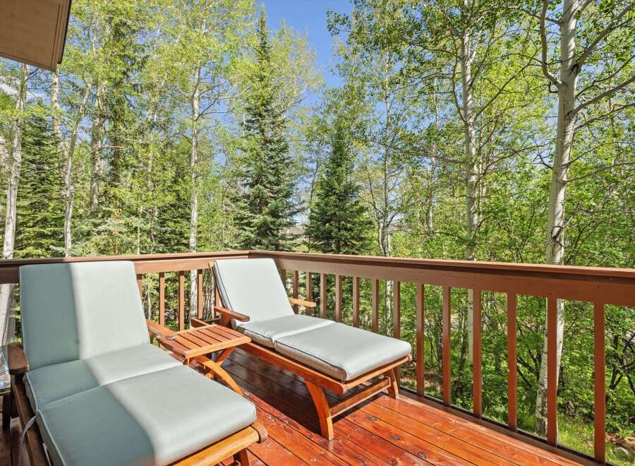 Enjoy the serene mountain views from this charming deck, perfect for relaxing or entertaining.