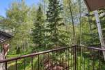 Enjoy the serene mountain views from this private balcony, surrounded by lush aspen and pine trees.
