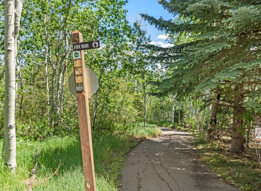 Discover the natural beauty surrounding this property with a well-maintained trail perfect for outdoor adventures.