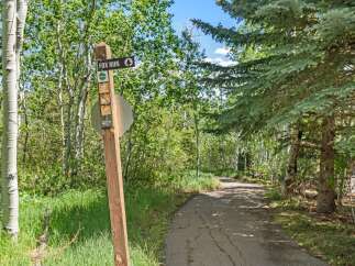 Discover the natural beauty surrounding this property with a well-maintained trail perfect for outdoor adventures.