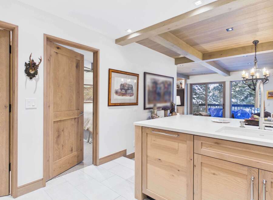 This stunning property boasts a beautifully designed kitchen with custom cabinetry and a spacious island, perfect for culinary enthusiasts.