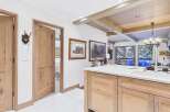 This stunning property boasts a beautifully designed kitchen with custom cabinetry and a spacious island, perfect for culinary enthusiasts.