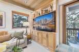 This stunning living room boasts a custom-built entertainment center, perfect for cozy nights in.