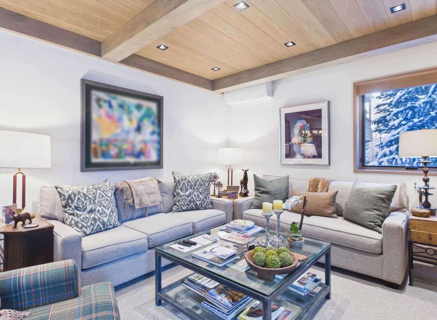 This cozy living room features a comfortable sofa, perfect for relaxing after a long day.