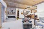 This stunning living space boasts a cozy fireplace, perfect for chilly evenings.