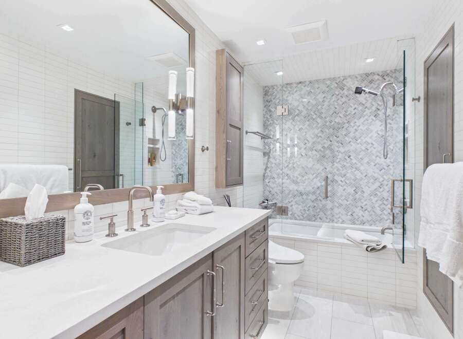 This stunning bathroom boasts a modern design with sleek finishes and ample space.
