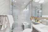 Step into luxury with this stunning bathroom featuring a modern design and high-end finishes.