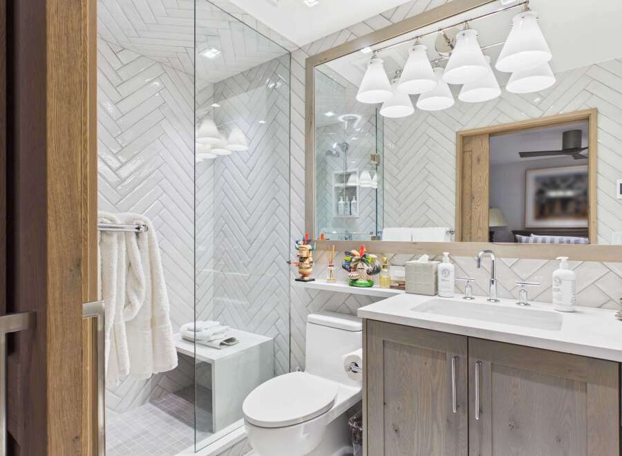 This stunning bathroom features a modern design with a sleek vanity and a luxurious shower.
