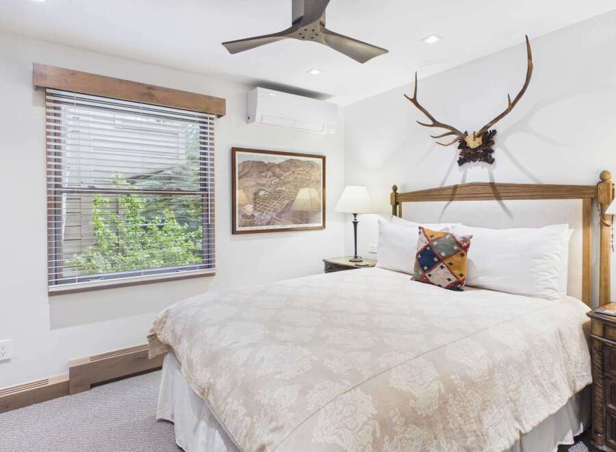 Experience rustic charm and modern comfort in this inviting bedroom.
