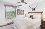 Experience rustic charm and modern comfort in this inviting bedroom.