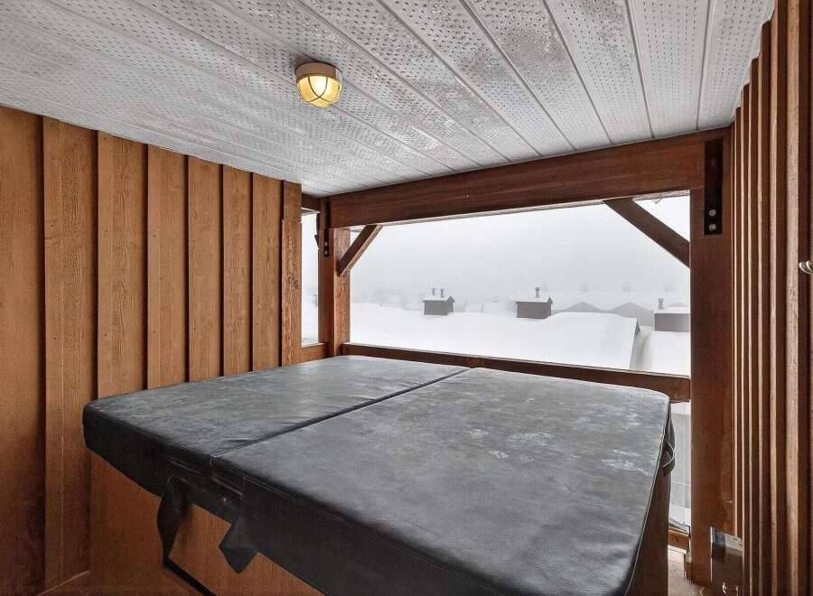 Enjoy breathtaking views from this luxurious property featuring a private hot tub.