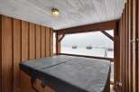 Enjoy breathtaking views from this luxurious property featuring a private hot tub.