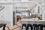 Step into this stunning kitchen, a perfect blend of modern design and coastal charm.