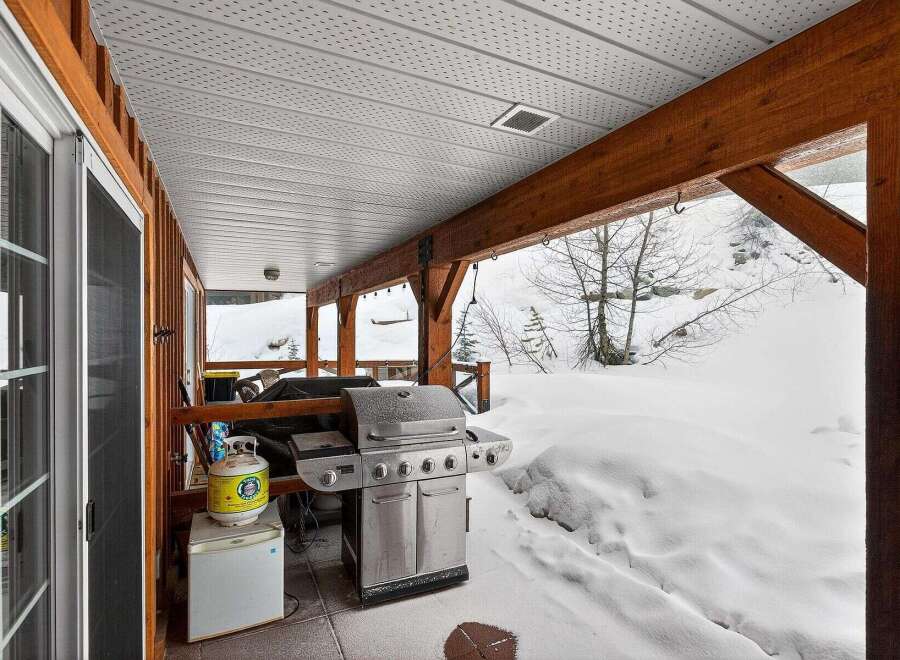 Enjoy outdoor cooking in style with this stunning property featuring a covered patio and a built-in grill.